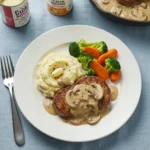 Cube steak recipe with mushroom soup, mashed potatoes, and colorful vegetables